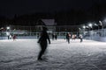 People are skating on winter skating rink Royalty Free Stock Photo