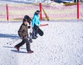 People ski with and snowboard