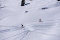 Skiers on dolomites mountain snow landscape in winter