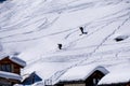 Skiers on dolomites mountain snow landscape in winter