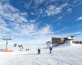 People skiing and snowboarding