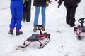 People with sledge climbing at the snowy hill on winter park in Bakuriani Royalty Free Stock Photo