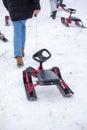 People with sledge climbing at the snowy hill on winter park in Bakuriani Royalty Free Stock Photo