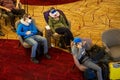 People sleep in chairs in the airport lounge in a mask and a respirator. safe travel after a pandemic Royalty Free Stock Photo