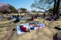 People sleep, sit, eat, talk. It`s young parents with children or the elderly - a morning in Shinjuku Gyoen Park, where about