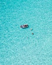 People on a small boat in the middle of the ocean, enjoying the view of the horizon