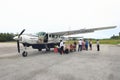 People by small Cesna airplane on airport in Numfor Royalty Free Stock Photo