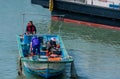 People in small fishing boat in Gungpyeong hang port Royalty Free Stock Photo