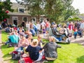 People with snacks and drinks on street food festival in histor