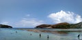 People snorkle in the water of Hanauma Bay