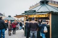 People socialising inside Christmas and New Year`s Market at Schonbrunn Palace, Vienna, Austria.