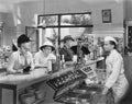 People at a soda fountain Royalty Free Stock Photo