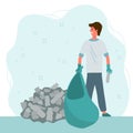 People sort waste. An environmental man removes a mountain of garbage in eco bags. Ecology, cleaning the earth from glass, metal, Royalty Free Stock Photo