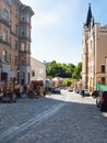 People and souvenir shops on Andriyivskyy Descent