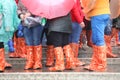 people with special waterproof gaiters on the steps of the bridg