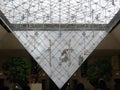 Cleaning of the pyramid of the Louvre to Paris in France.