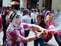 People spraying foam at carnival party, Ecuador