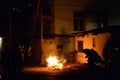 People stand around a fire to celebrate the Nowruz in Baku, Azerbaijan