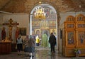 People stand on church service in Church of the Assumption. Poshekhonje, Yaroslavl region