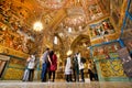 People stand inside the armenian ÃÂathedral with magical paints