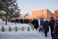 People stand in line in the cathedral for blessed water