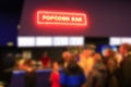 People stand in line for popcorn