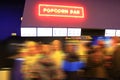 People stand in line for popcorn