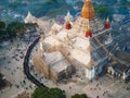 people stand in line at a temple