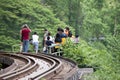 People stand for photo Train on platform Krasae Cave