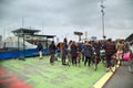 People stand in the queue for the ferry across the river in Amsterdam, The Netherlands.