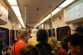 People stand and sit inside a Crowded VTA train transit ride aft