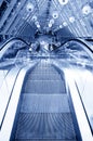 People standing on escalator in business center Royalty Free Stock Photo