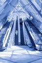 People standing on escalator in business center Royalty Free Stock Photo