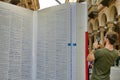 People standing in front of huge open book mock up