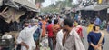 PEOPLE STANDING IN FRONT OF ROAD SIDE RATION SHOP,INDIA