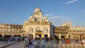 People standing near the white clock tower of The Golden Temple Royalty Free Stock Photo