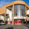 People Standing Outside A Large John Lewis Department Store