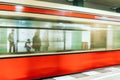 People standing at platform and blurred train coming to the subway station in city Berlin at Germany Royalty Free Stock Photo