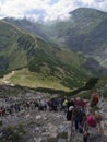 People are standing in a queue on peak Giewont