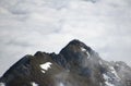 People standing on a top of muntain over the clouds. Royalty Free Stock Photo