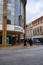 People Staning Outside A Modern John Lewis Department Store In Kingston