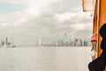 People on Staten island ferry. Skyline of New York City at the background Royalty Free Stock Photo