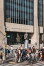 People by the statue of Adam Clayton Powell Jr. in Harlem, New York, USA Royalty Free Stock Photo