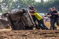 people on a Stockcar on a dirty track at a Stockcar challenge. Royalty Free Stock Photo