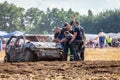 people on a Stockcar on a dirty track at a Stockcar challenge. Royalty Free Stock Photo