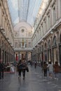 People stolling The Galeries Royales Saint-Hubert which is a glazed shopping arcade in Brussels that preceded other famous 19th-