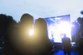 People at a street concert in the evening