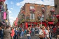 People in the street in front of the famous Temple Bar, in Dublin Ireland Royalty Free Stock Photo