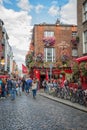 People in the street in front of the famous Temple Bar, in Dublin Ireland Royalty Free Stock Photo