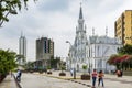 People in a street in front of the La Ermita Church in city of Cali, Colombia